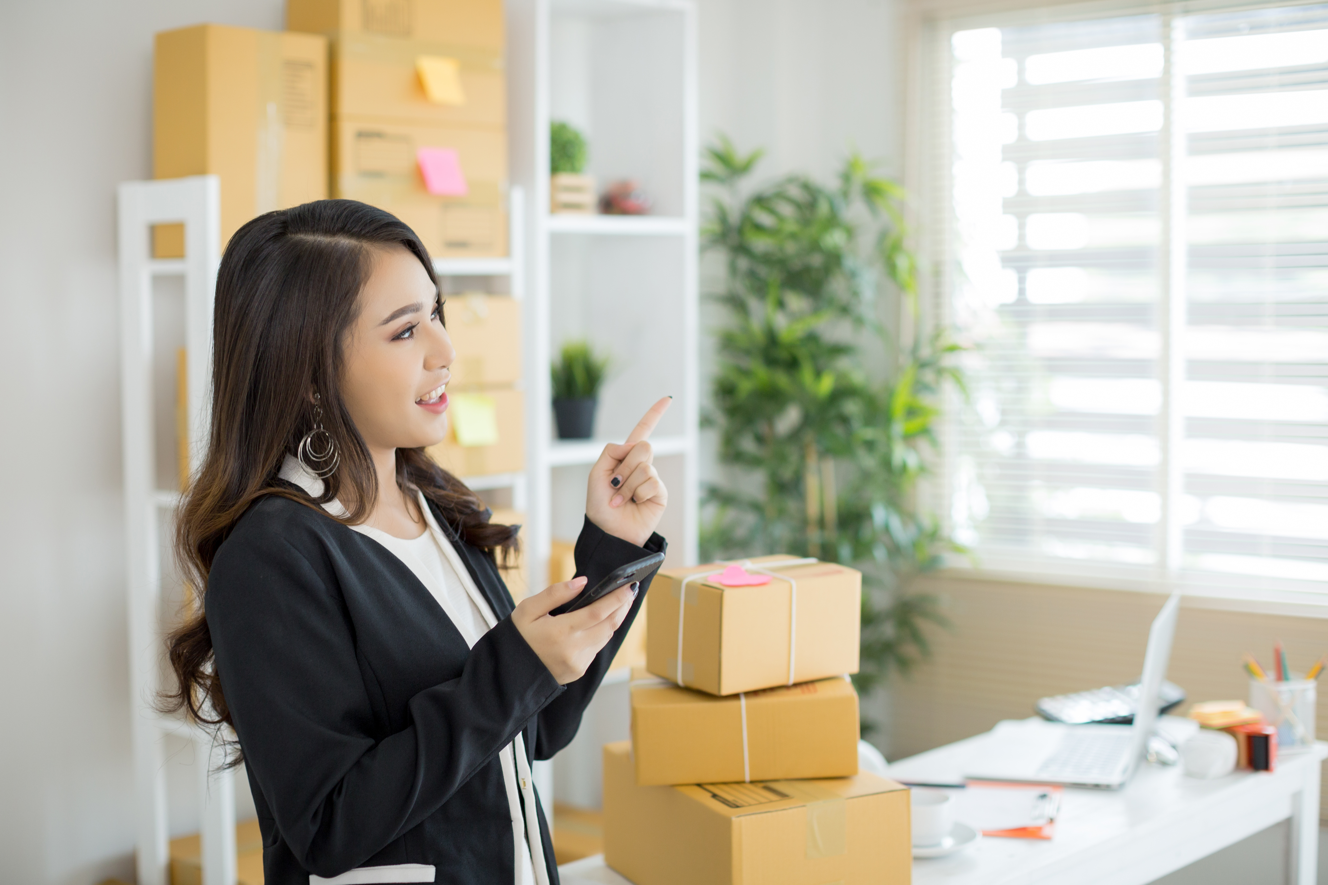 Business Owner Working At Home Office Packaging On Background