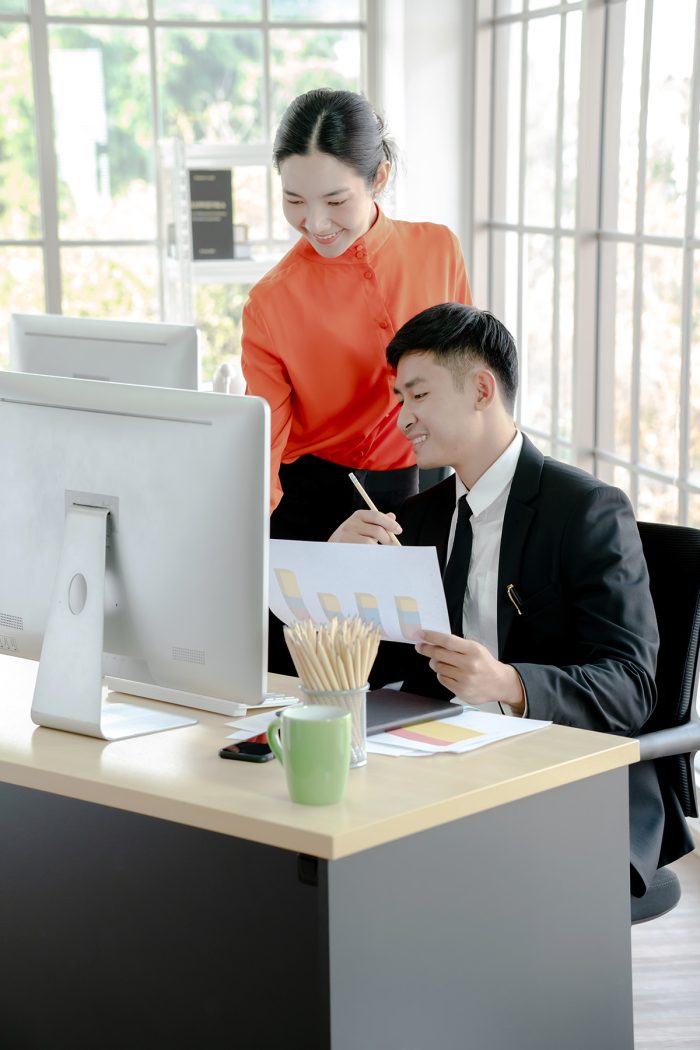 Businessman Discussing With Female Coworker Desk 1737539690