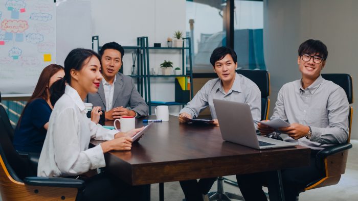 Millennial Asia Businessmen And Businesswomen Having Conference